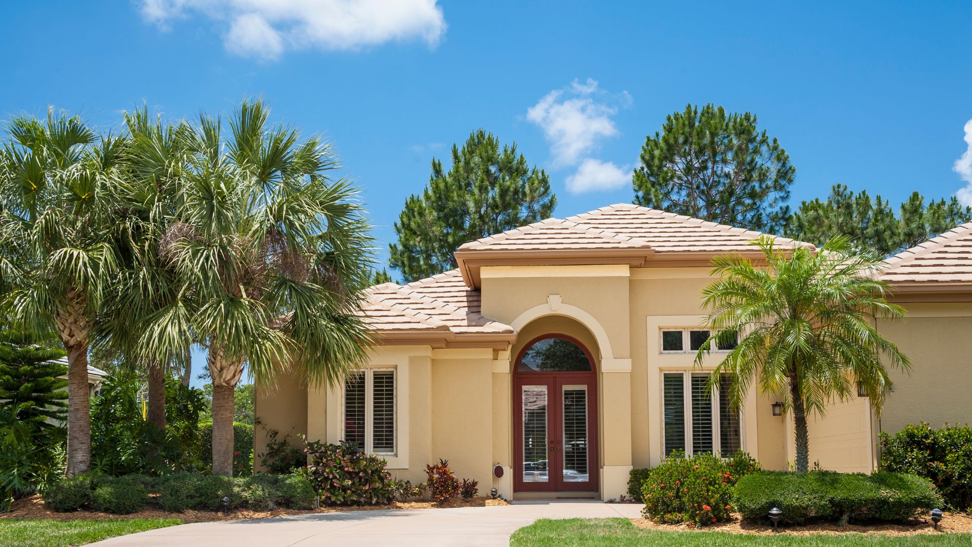 Website%20Dev.%20-%202025-07-02T153952.245 exterior of a yellow house in florida